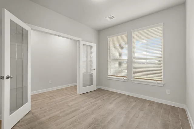 a view of an empty room with a window