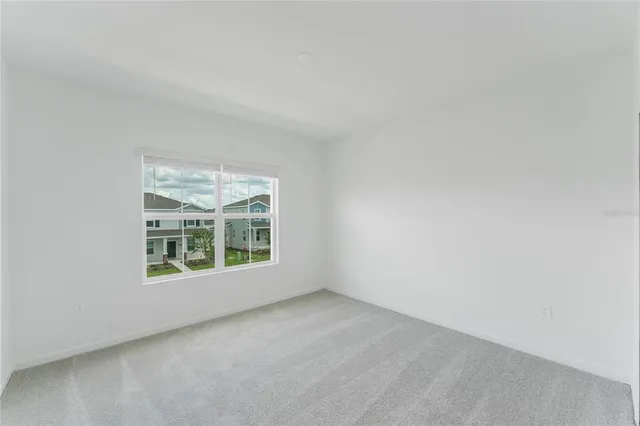 a bathroom with a sink a toilet a mirror and shower