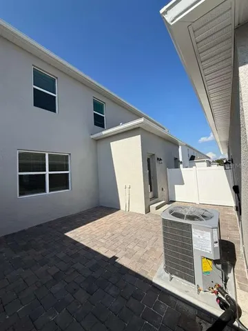 a view of a swimming pool with a table and chairs