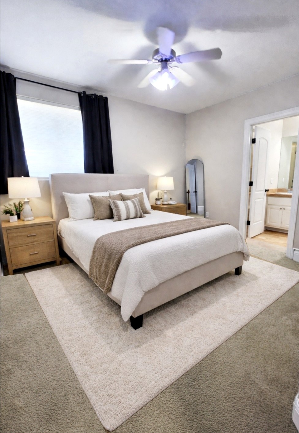 152 Silver Hawk Court Dripping Springs, TX 78620 - Photo 21 of 31 a bedroom with bed and a chandelier