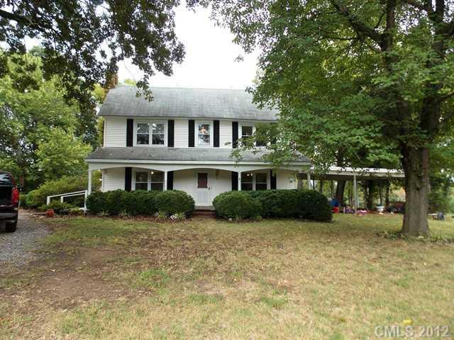 370 Dutchman Road Harmony, NC 28634 - Photo 2 of 11 a front view of a house with a yard and trees