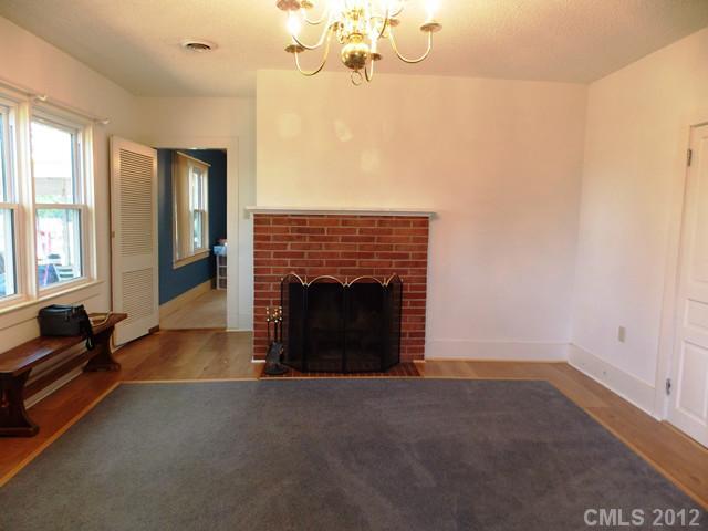 370 Dutchman Road Harmony, NC 28634 - Photo 7 of 11 a living room with furniture and a fireplace