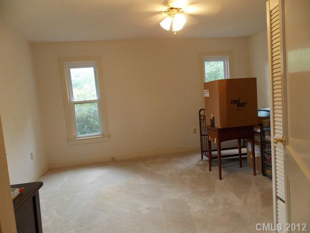 370 Dutchman Road Harmony, NC 28634 - Photo 9 of 11 a view of workspace with window and furniture