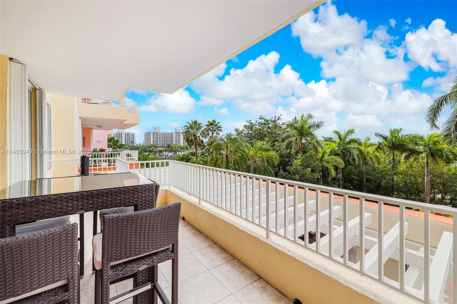 789 Crandon Boulevard, Unit 403 Key Biscayne, FL 33149 - Photo 15 of 27 a view of a balcony with wooden floor