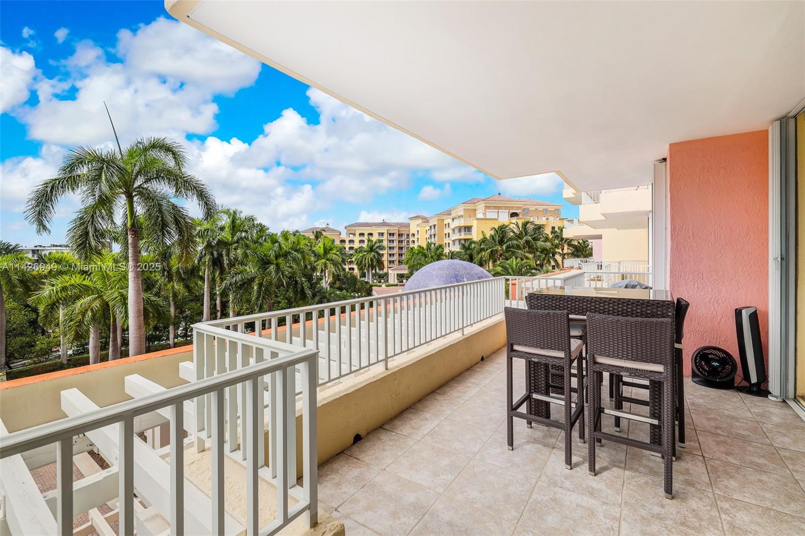 789 Crandon Boulevard, Unit 403 Key Biscayne, FL 33149 - Photo 16 of 27 a view of a chairs and table in the balcony