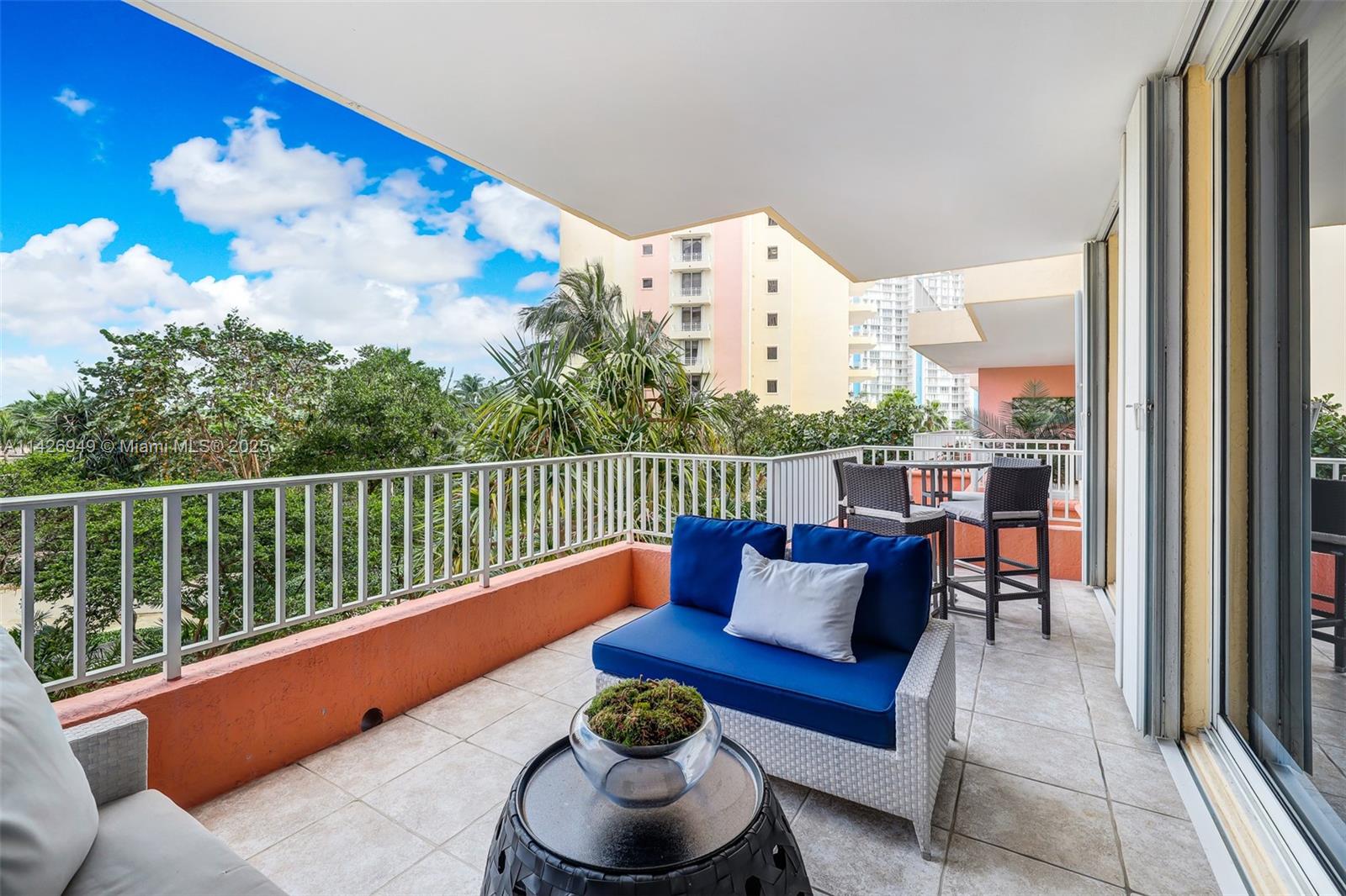 789 Crandon Boulevard, Unit 403 Key Biscayne, FL 33149 - Photo 17 of 27 a balcony with furniture and city view
