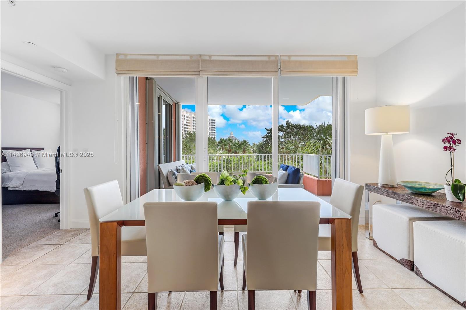 789 Crandon Boulevard, Unit 403 Key Biscayne, FL 33149 - Photo 4 of 27 a view of a dining room with furniture window and outside view