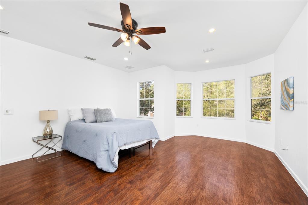 9405 Southwest 31st Lane Gainesville, FL 32608 - Photo 20 of 45 a spacious bedroom with a bed and a large window