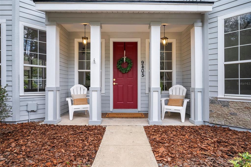 9405 Southwest 31st Lane Gainesville, FL 32608 - Photo 2 of 45 a front view of a house with a lounge chair