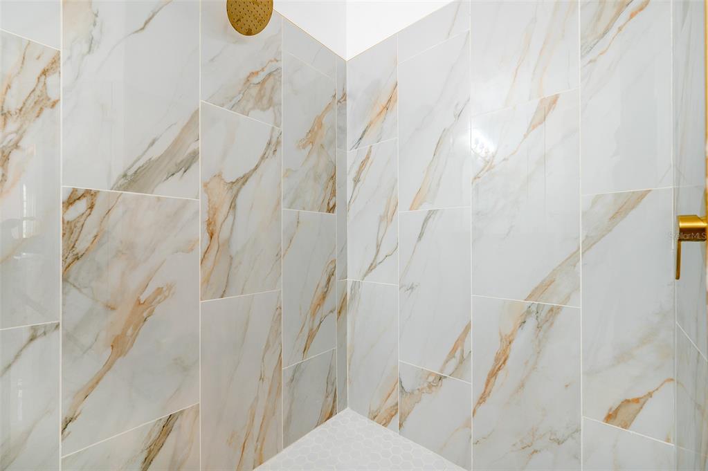 9405 Southwest 31st Lane Gainesville, FL 32608 - Photo 25 of 45 a bathroom with a shower curtain