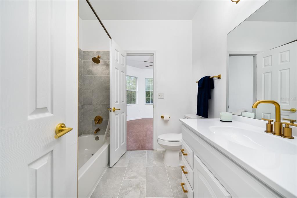 9405 Southwest 31st Lane Gainesville, FL 32608 - Photo 29 of 45 a bathroom with a sink toilet and shower