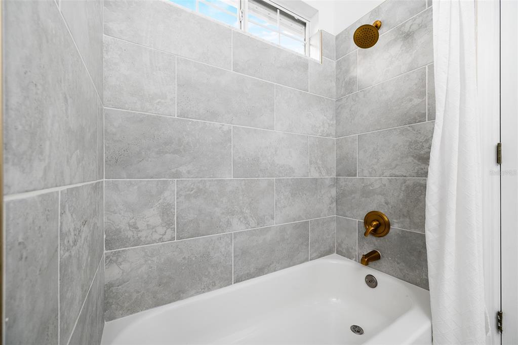 9405 Southwest 31st Lane Gainesville, FL 32608 - Photo 30 of 45 a bathroom with a tub