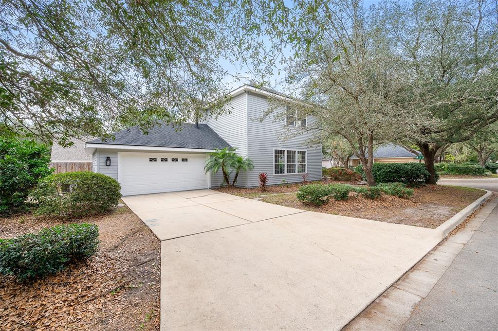 9405 Southwest 31st Lane Gainesville, FL 32608 - Photo 39 of 45 front view of house with a yard and trees