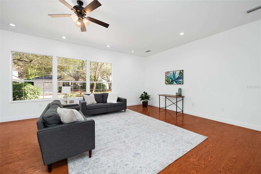 9405 Southwest 31st Lane Gainesville, FL 32608 - Photo 4 of 45 a living room with furniture and a large window