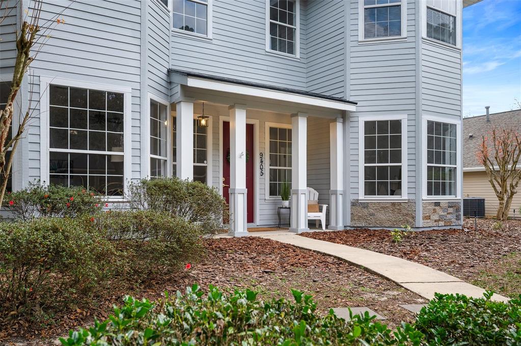 9405 Southwest 31st Lane Gainesville, FL 32608 - Photo 43 of 45 a front view of a house with a garden