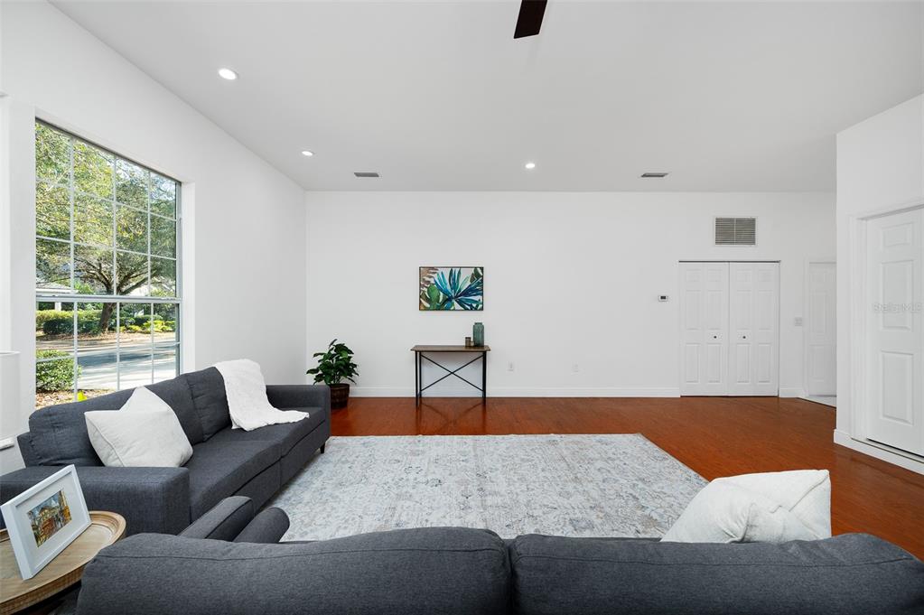 9405 Southwest 31st Lane Gainesville, FL 32608 - Photo 5 of 45 a living room with furniture and a large window