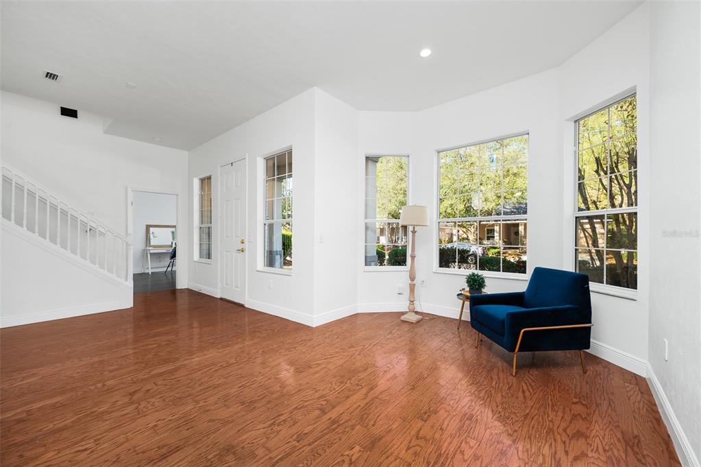 9405 Southwest 31st Lane Gainesville, FL 32608 - Photo 6 of 45 a living room with furniture and a large window