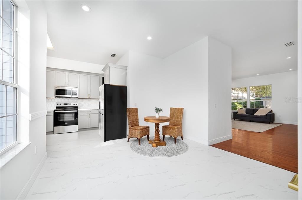 9405 Southwest 31st Lane Gainesville, FL 32608 - Photo 7 of 45 a kitchen with a table and chairs in it