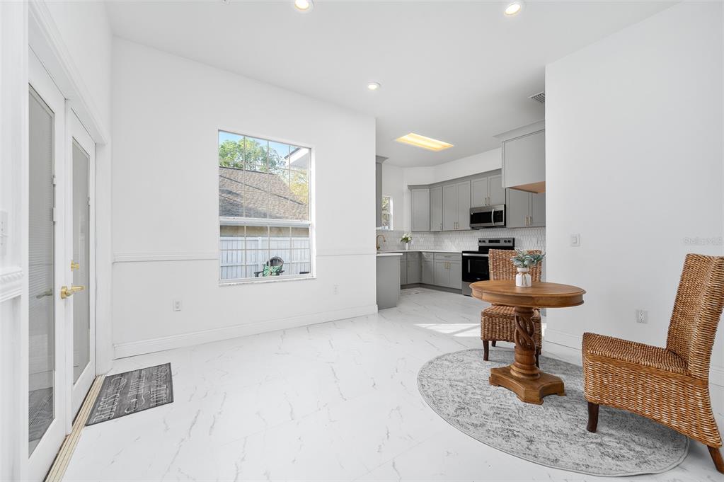 9405 Southwest 31st Lane Gainesville, FL 32608 - Photo 10 of 45 a living room with furniture and a wooden floor
