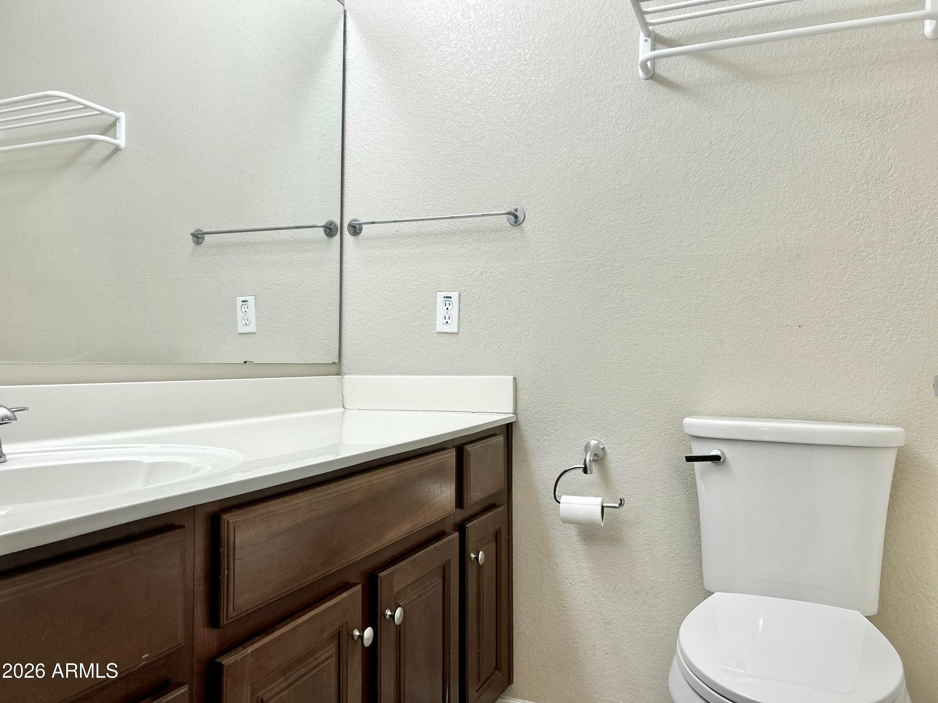 2401 East Rio Salado Parkway, Unit 1018 Tempe, AZ 85288 - Photo 17 of 19 a bathroom with a sink a toilet a vanity and mirror