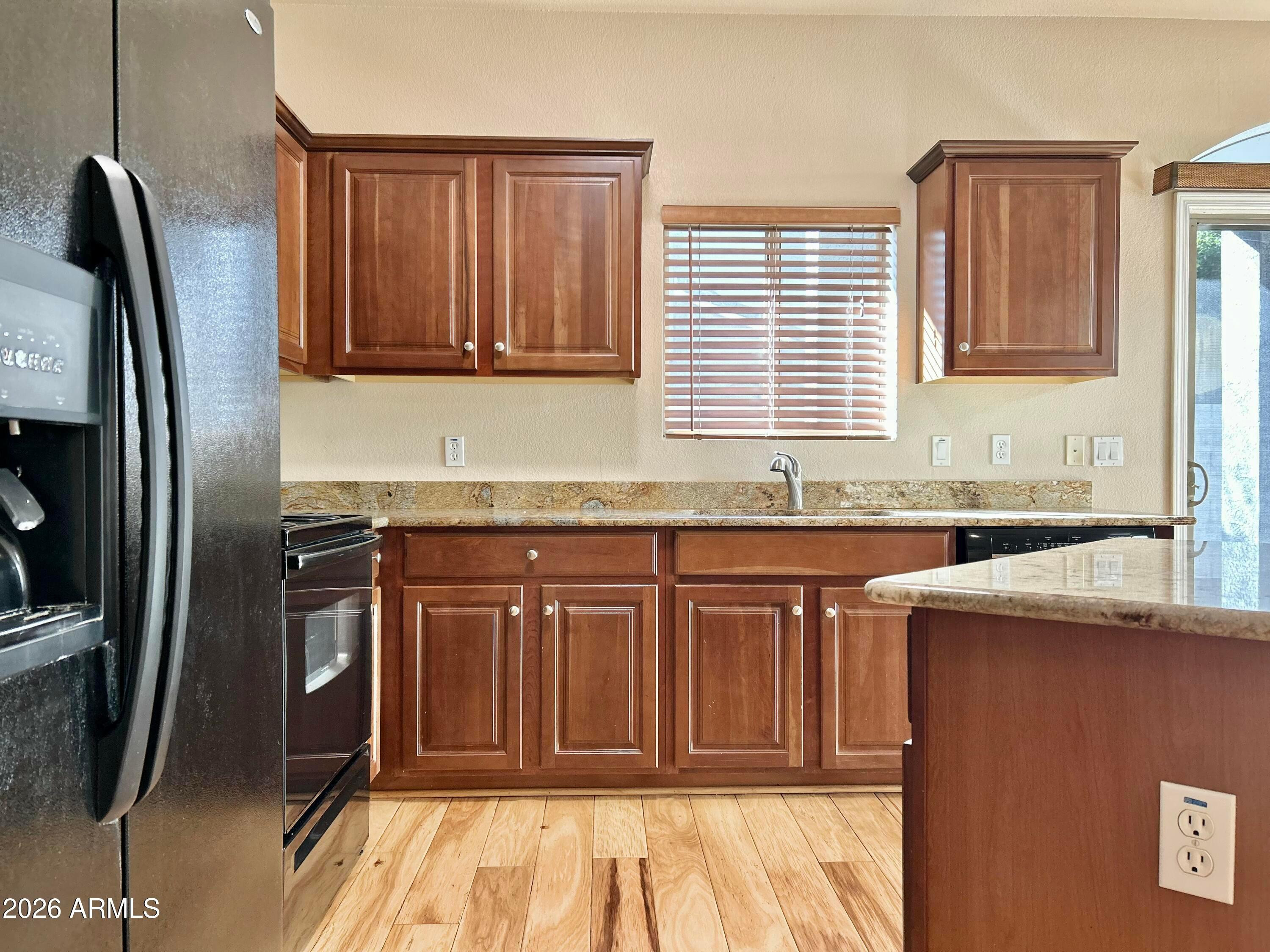 2401 East Rio Salado Parkway, Unit 1018 Tempe, AZ 85288 - Photo 7 of 19 a kitchen with stainless steel appliances granite countertop a refrigerator and a sink