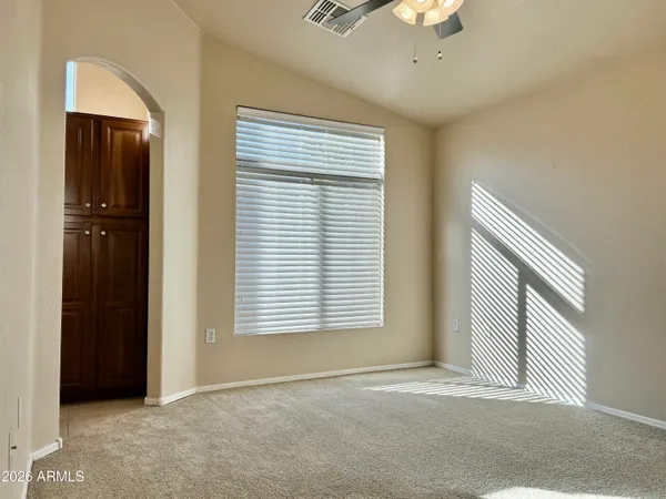 a view of an empty room with a window