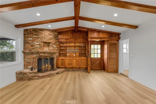 a view of a livingroom with a fireplace and furniture