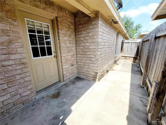 a view of front door and potted plants
