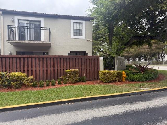 a garden with wooden fence