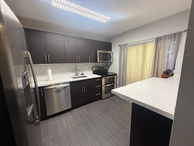 10525 Southwest 153rd Court, Unit 4 Miami, FL 33196 - Photo 11 of 33 a kitchen with a sink appliances and cabinets