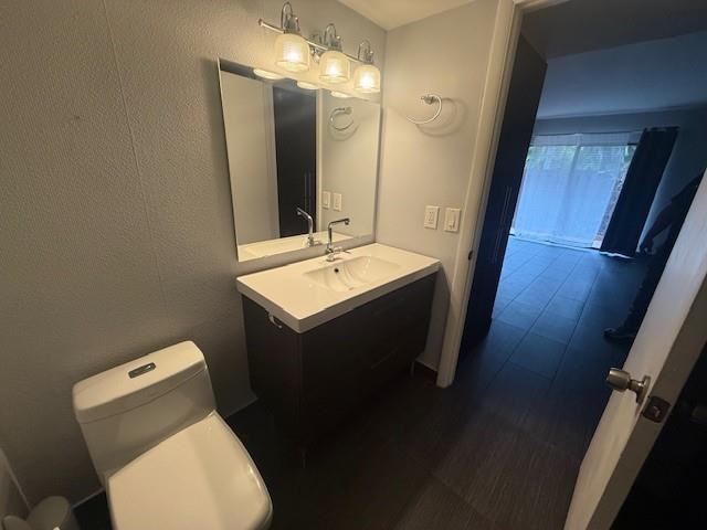 10525 Southwest 153rd Court, Unit 4 Miami, FL 33196 - Photo 14 of 33 a bathroom with a sink toilet and mirror