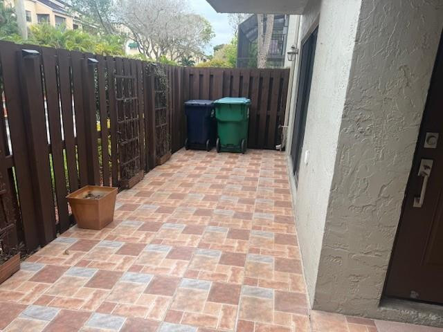 10525 Southwest 153rd Court, Unit 4 Miami, FL 33196 - Photo 7 of 33 a backyard of a house with wooden fence