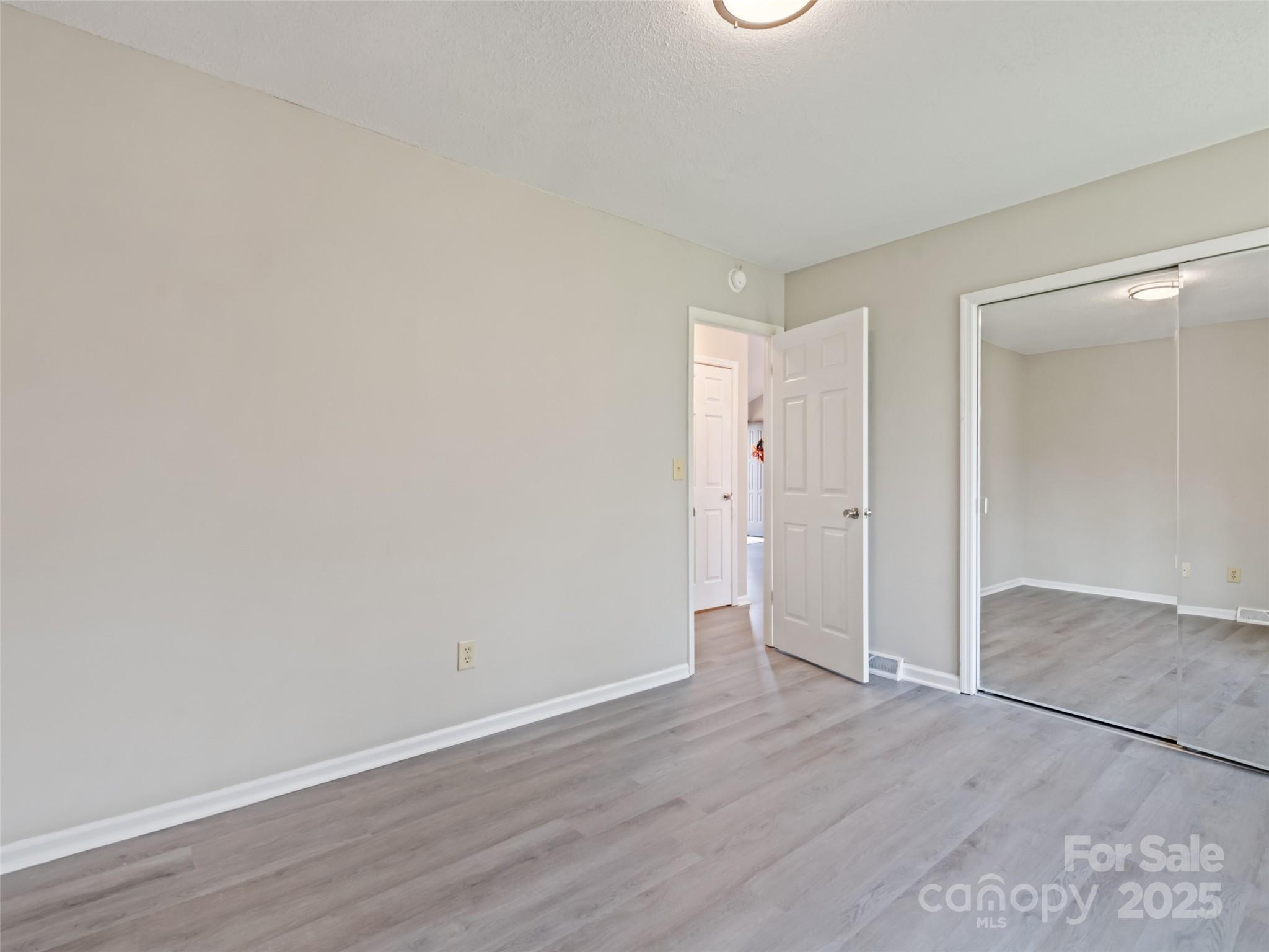 10 New Bern Drive Fletcher, NC 28732 - Photo 16 of 30 a view of an empty room with wooden floor