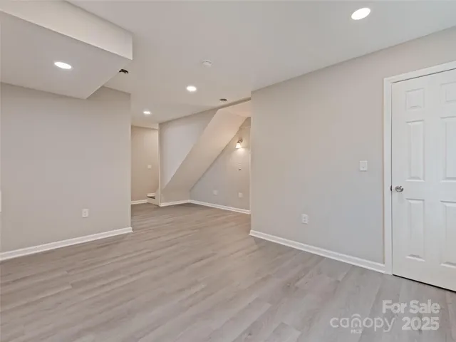 a bathroom with a sink toilet a mirror and shower