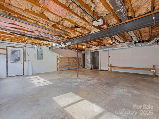 a view of backyard with wooden floor and fence