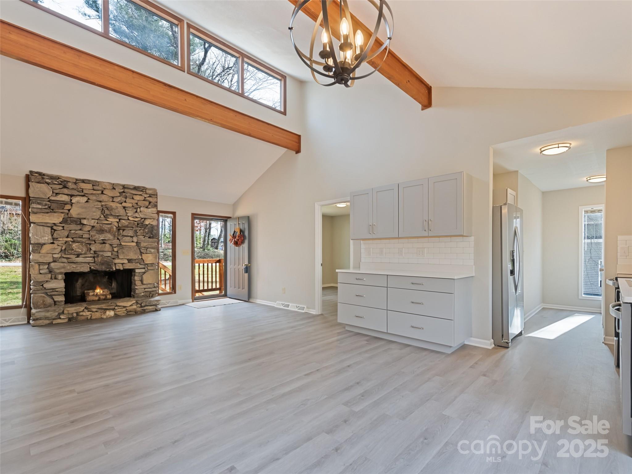10 New Bern Drive Fletcher, NC 28732 - Photo 3 of 30 a view of an empty room with wooden floor fireplace and windows