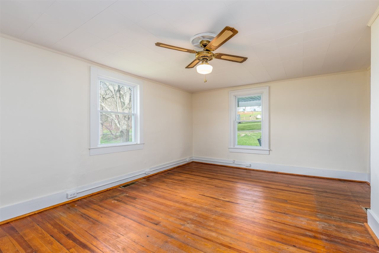 803 Wagon Shop Road Middlebrook, VA 24459 - Photo 24 of 50 a view of empty room with wooden floor and fan
