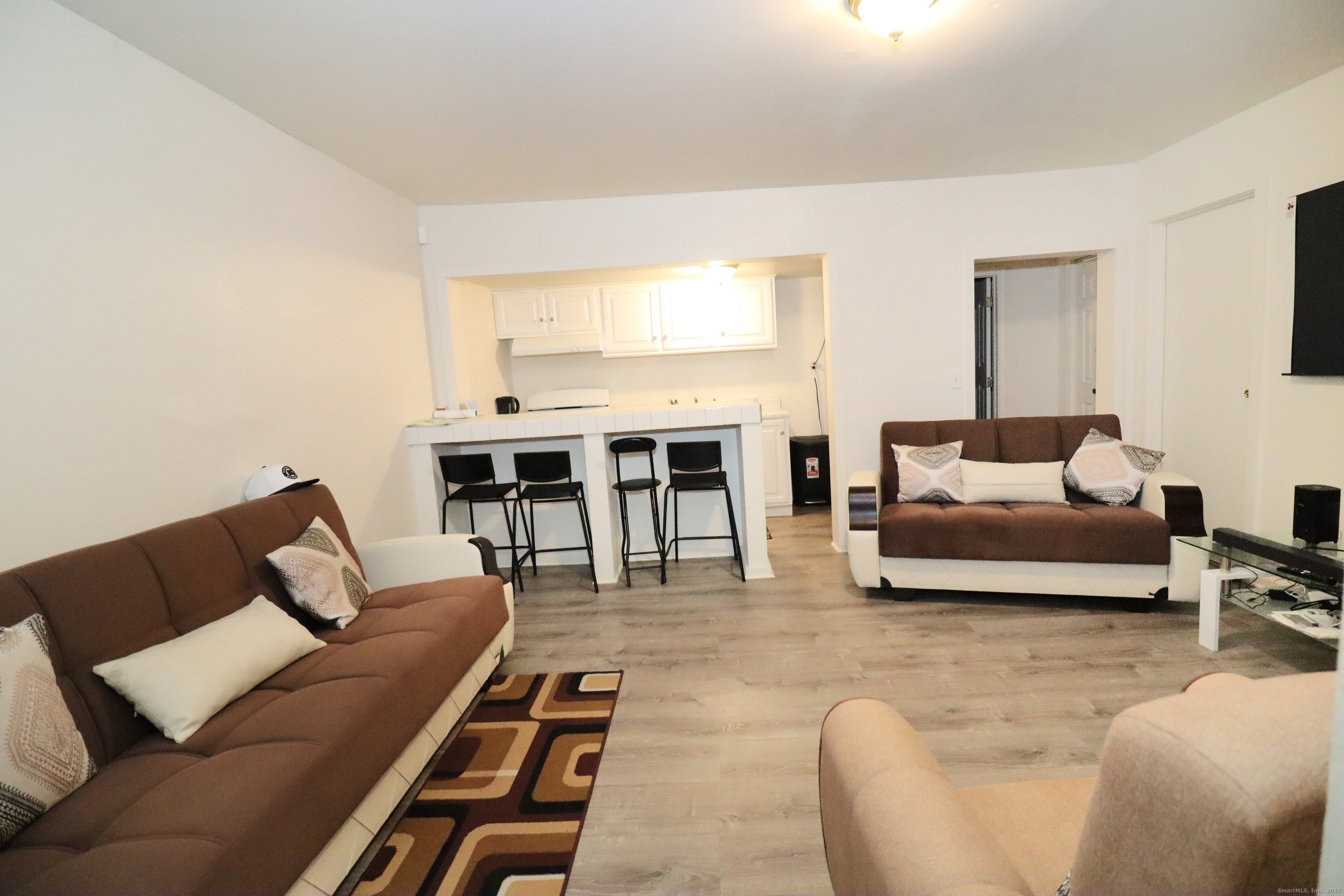 60 Olive Street Bridgeport, CT 06605 - Photo 11 of 34 a living room with furniture and a table