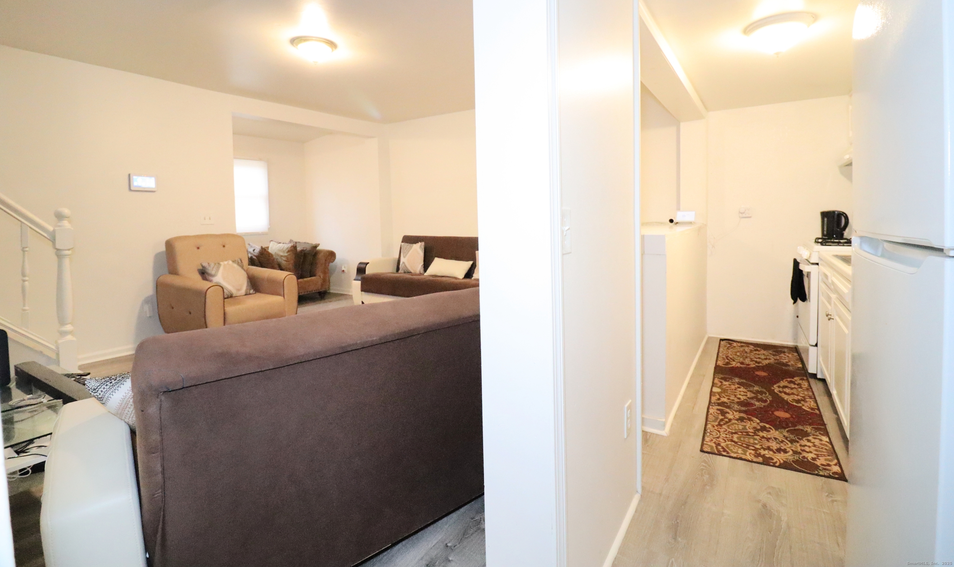 60 Olive Street Bridgeport, CT 06605 - Photo 15 of 34 a living room with furniture and a rug