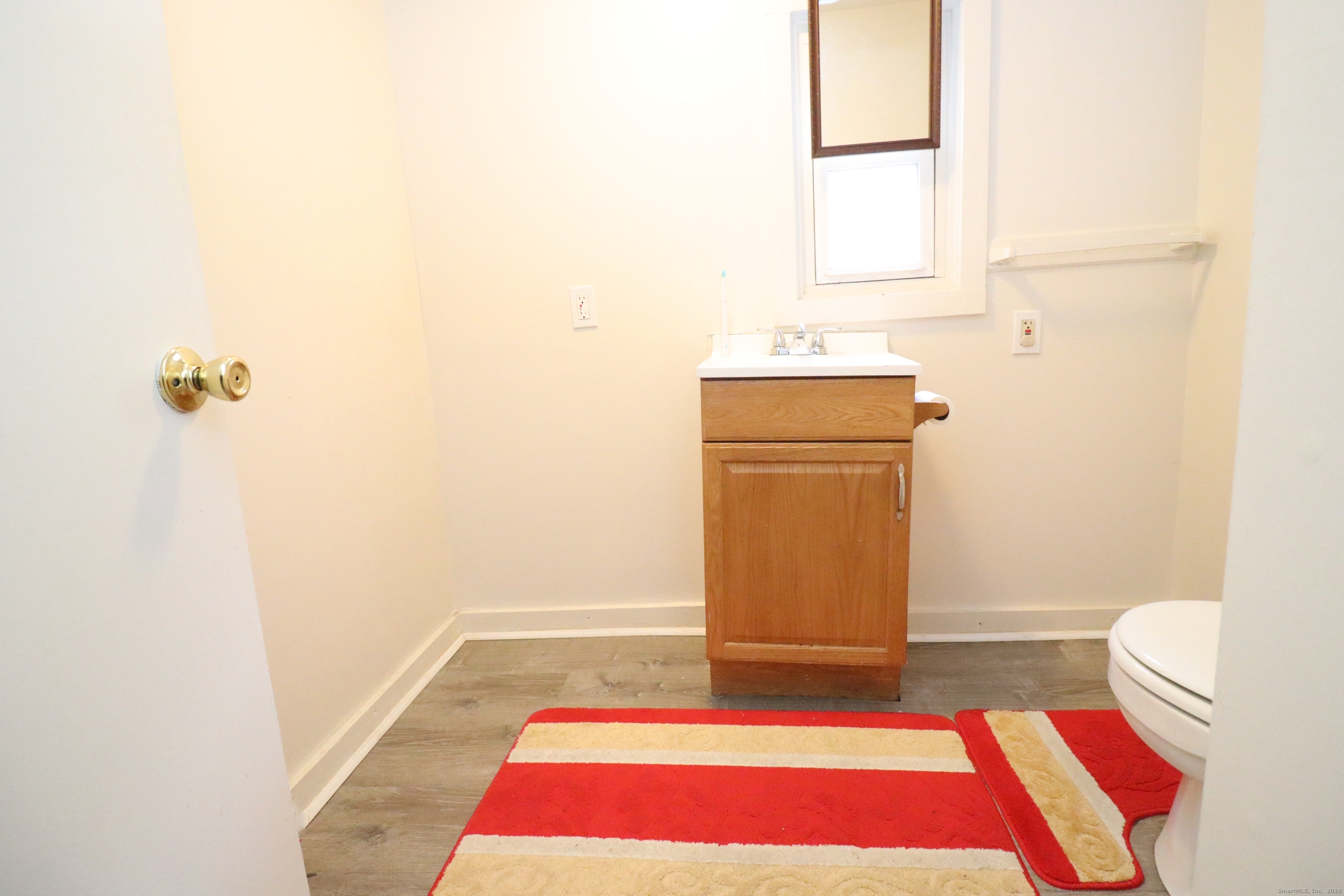 60 Olive Street Bridgeport, CT 06605 - Photo 19 of 34 a bathroom with a sink and a mirror