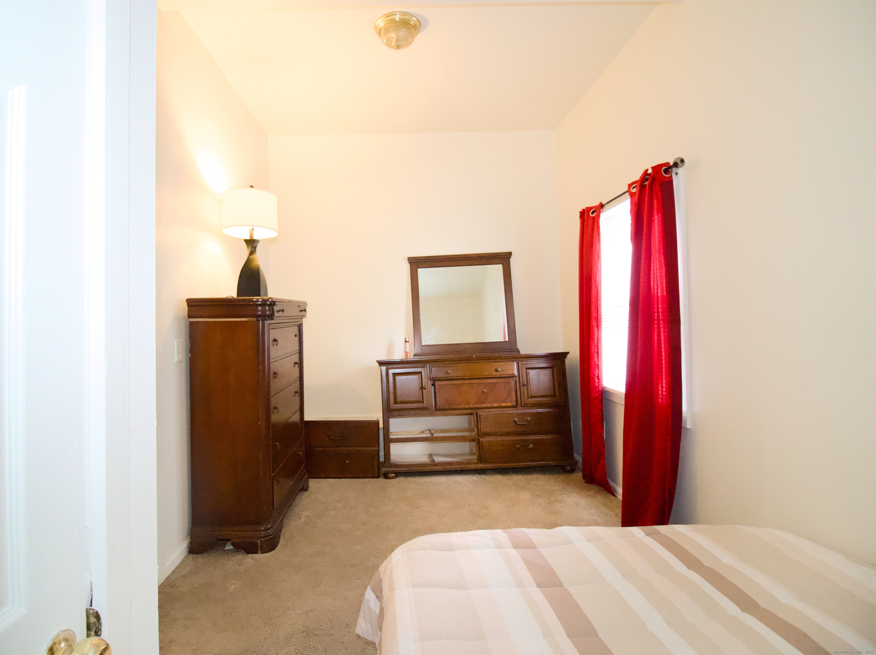 60 Olive Street Bridgeport, CT 06605 - Photo 20 of 34 a bedroom with a bed and dresser