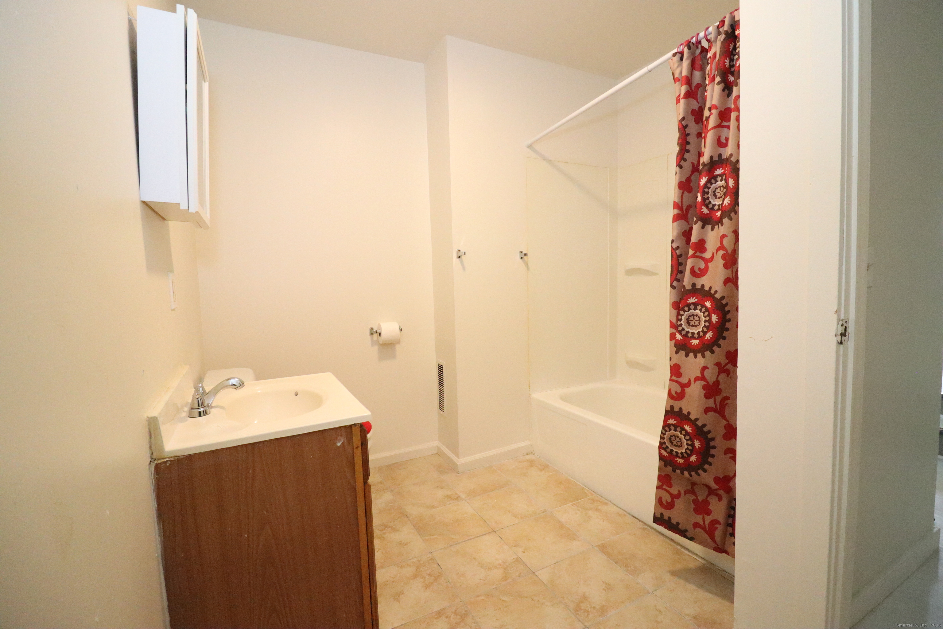 60 Olive Street Bridgeport, CT 06605 - Photo 24 of 34 a bathroom with a bathtub and shower