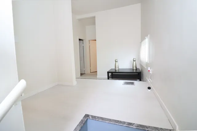 a view of a living room with furniture