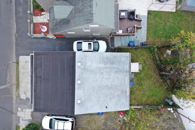an aerial view of a house with outdoor space and street view