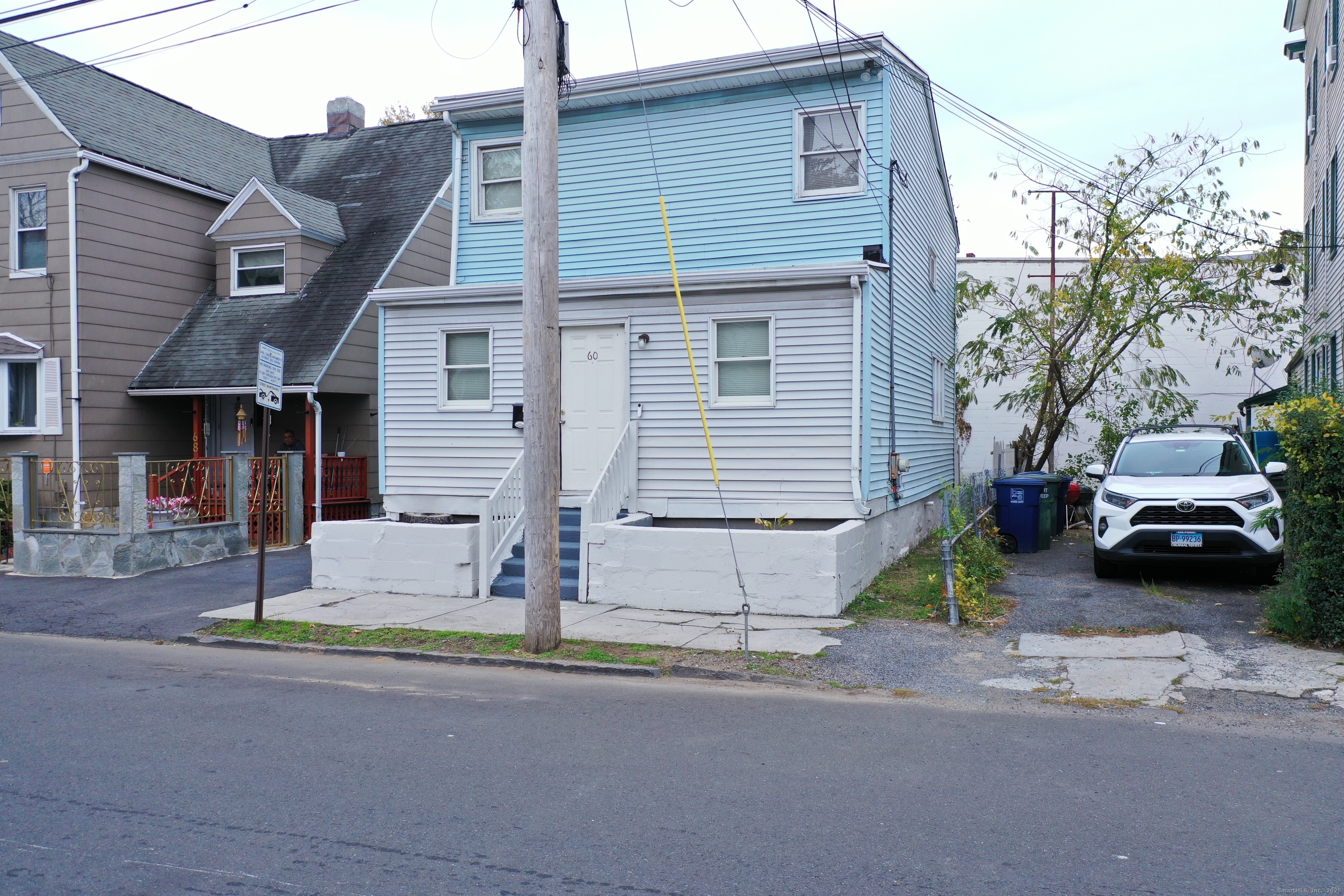 60 Olive Street Bridgeport, CT 06605 - Photo 6 of 34 a car parked in front of a house
