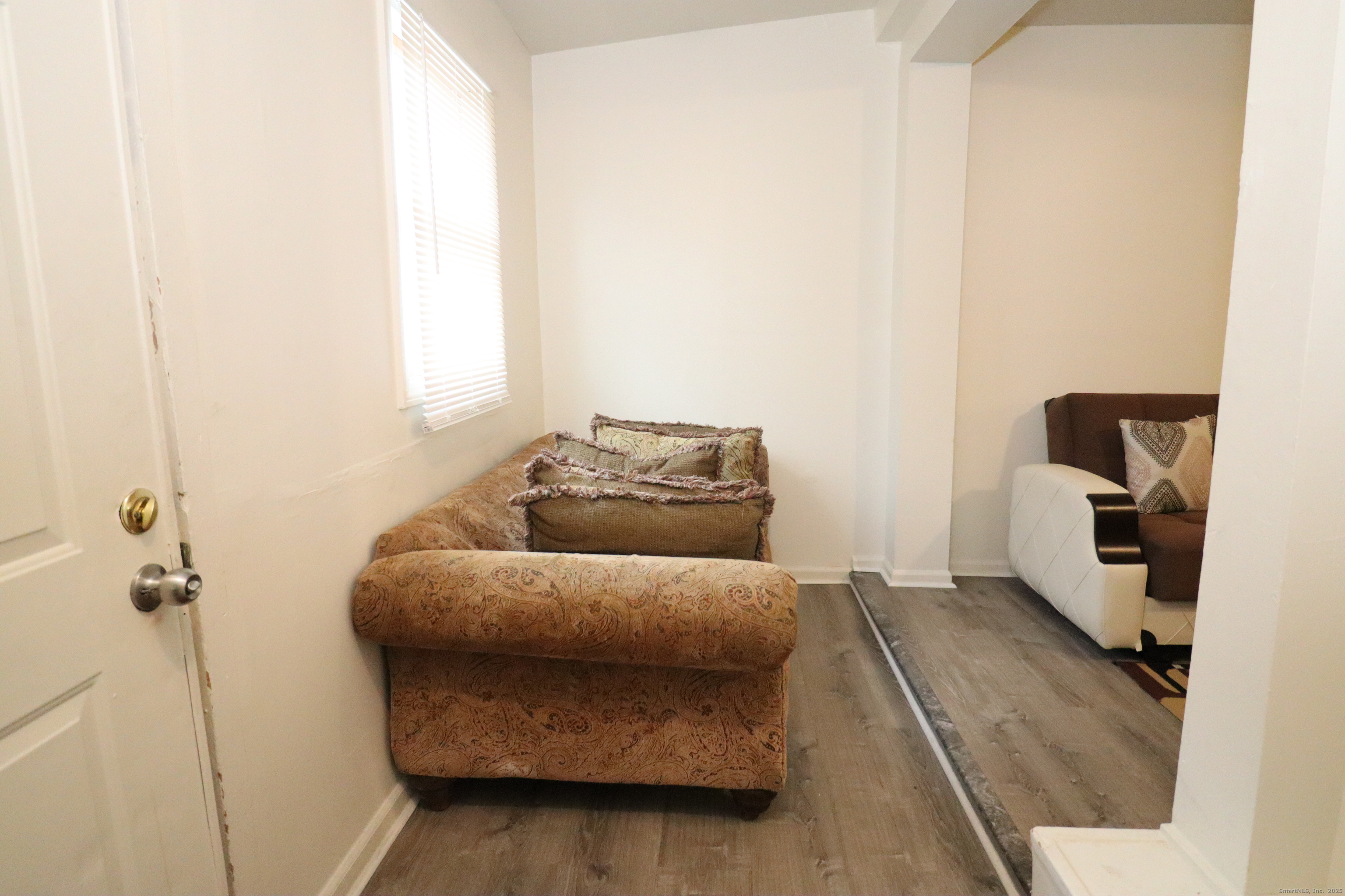 60 Olive Street Bridgeport, CT 06605 - Photo 7 of 34 a living room with furniture and a window