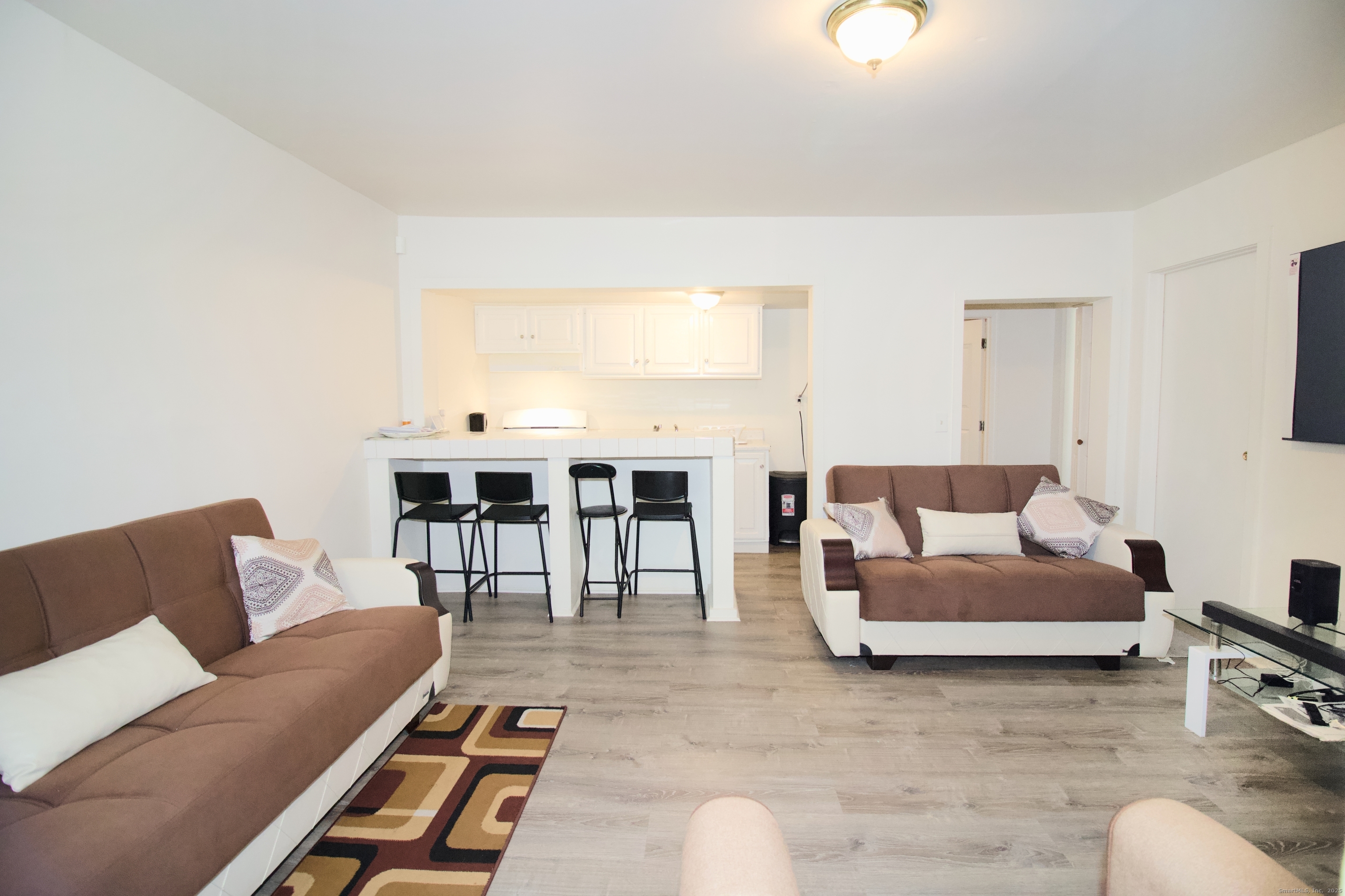 60 Olive Street Bridgeport, CT 06605 - Photo 8 of 34 a living room with furniture and a couch