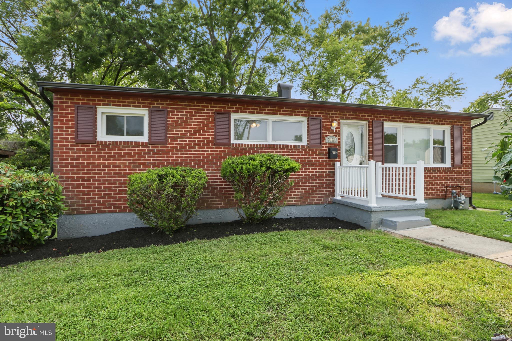 9021 Meadow Heights Road Randallstown, MD 21133 - Photo 1 of 41 a view of a house with a yard and plants