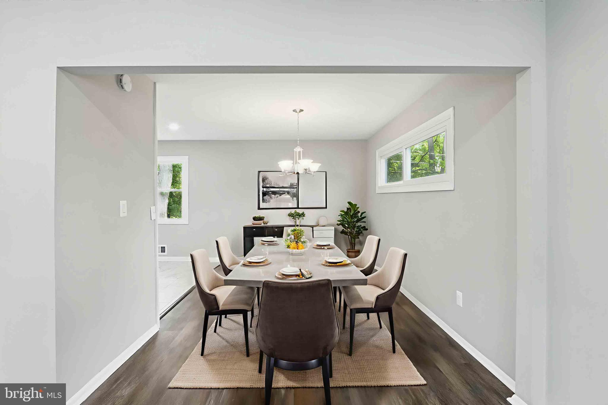 9021 Meadow Heights Road Randallstown, MD 21133 - Photo 13 of 41 a view of a dining room with furniture and wooden floor