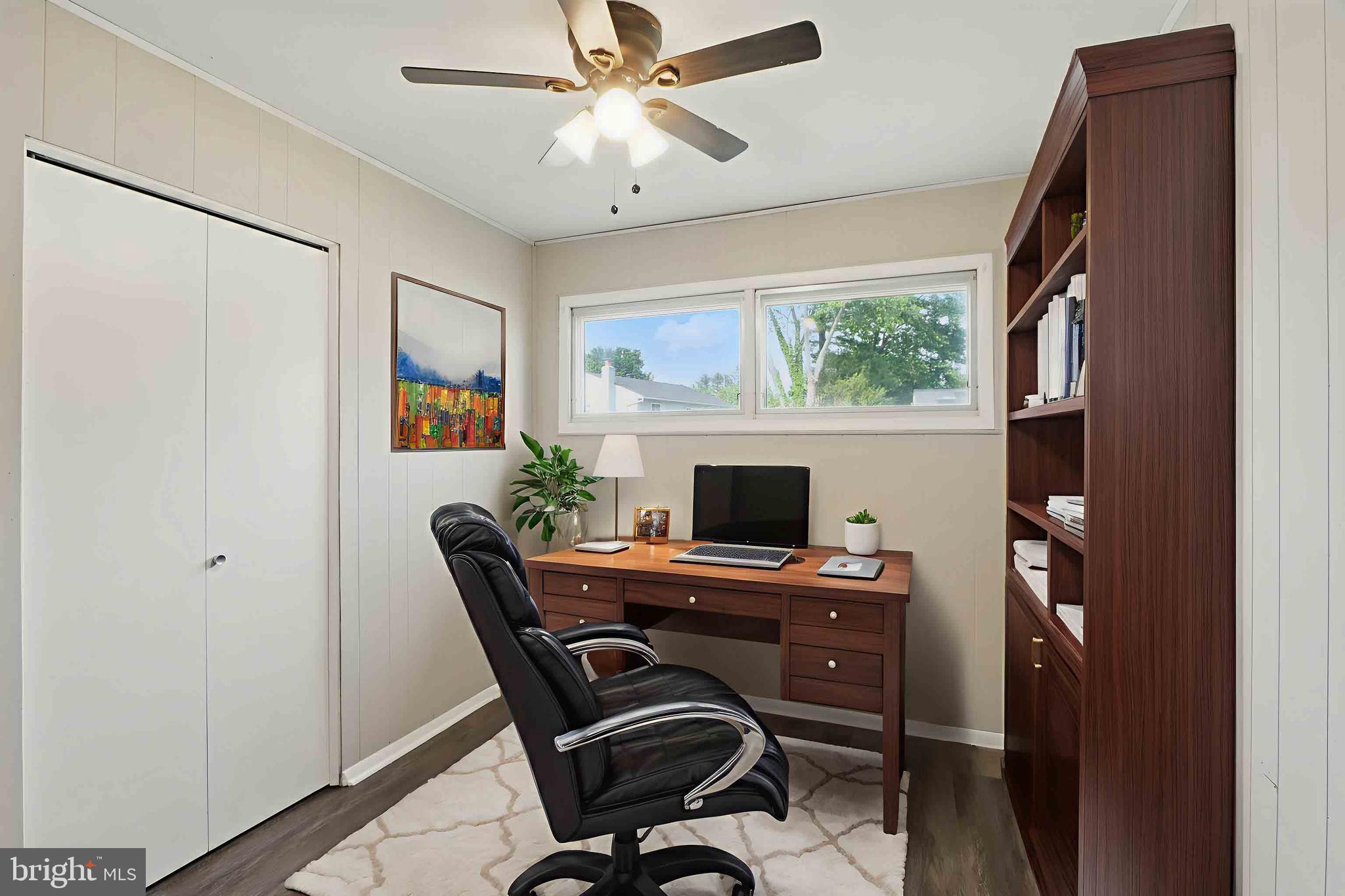 9021 Meadow Heights Road Randallstown, MD 21133 - Photo 15 of 41 a view of a workspace with furniture and a fireplace